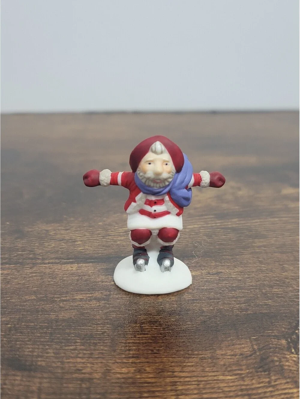 Department 56 Santa Figurine with Blue Scarf on Skates